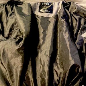 The brand is repair and the color is grey and is a large